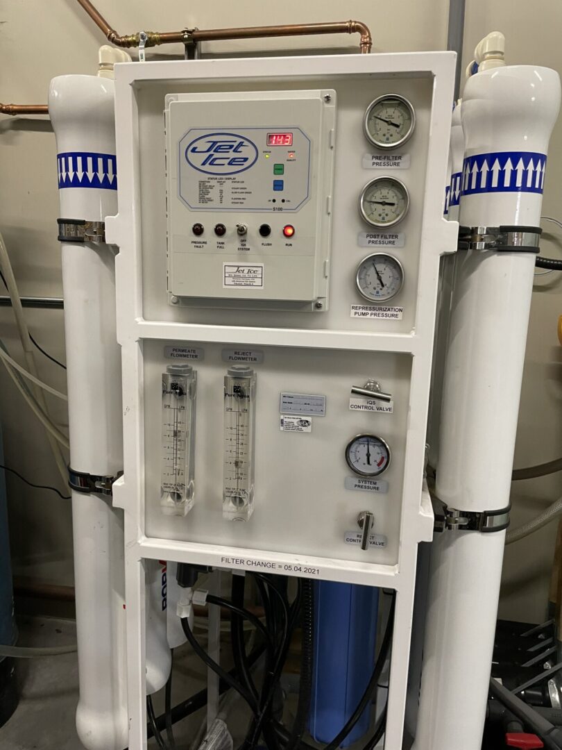 A water purification system with multiple filters and valves.