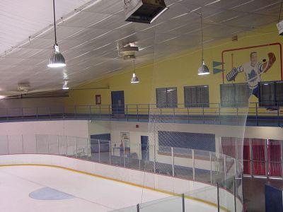 A view of an indoor ice rink from the side.