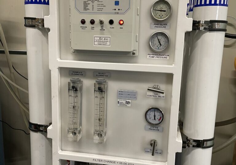 A water purification system with multiple filters and valves.